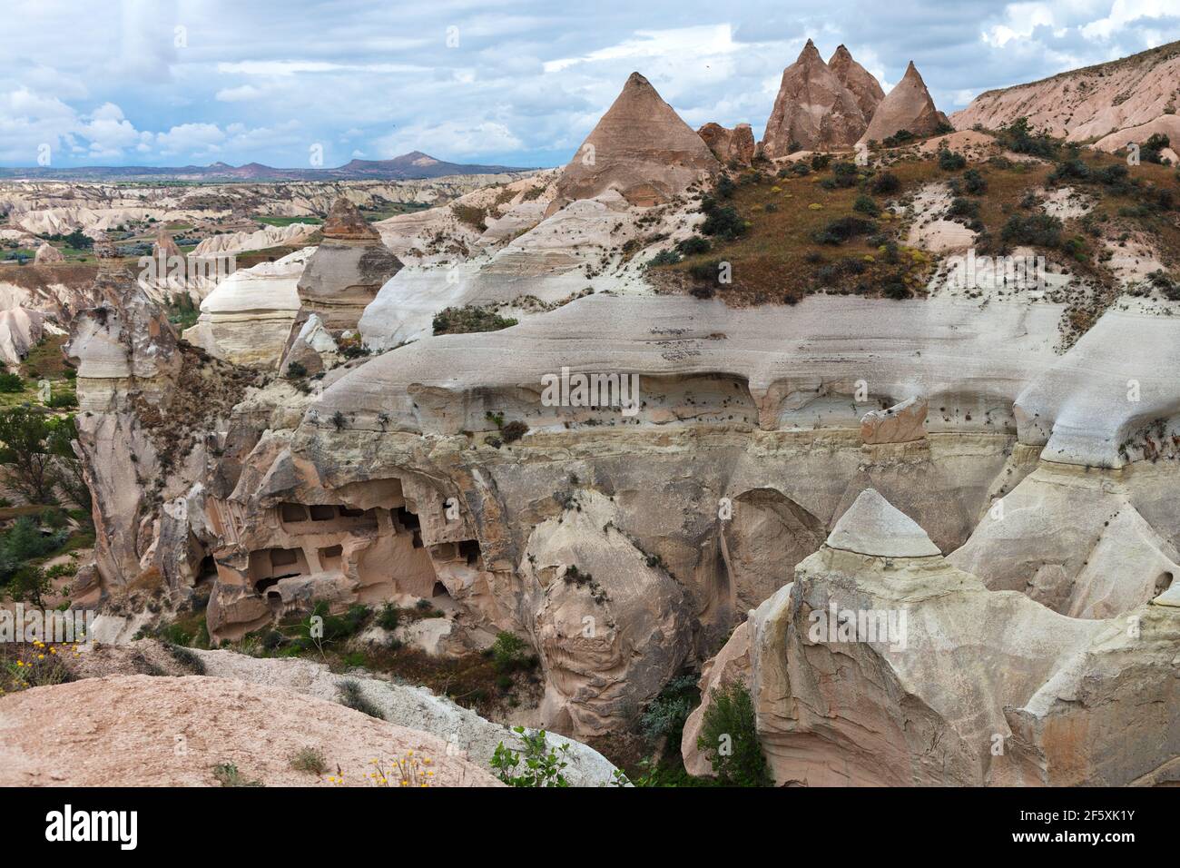 Rocky mountain ranges of Cappadocia of red and white sandstone, ancient