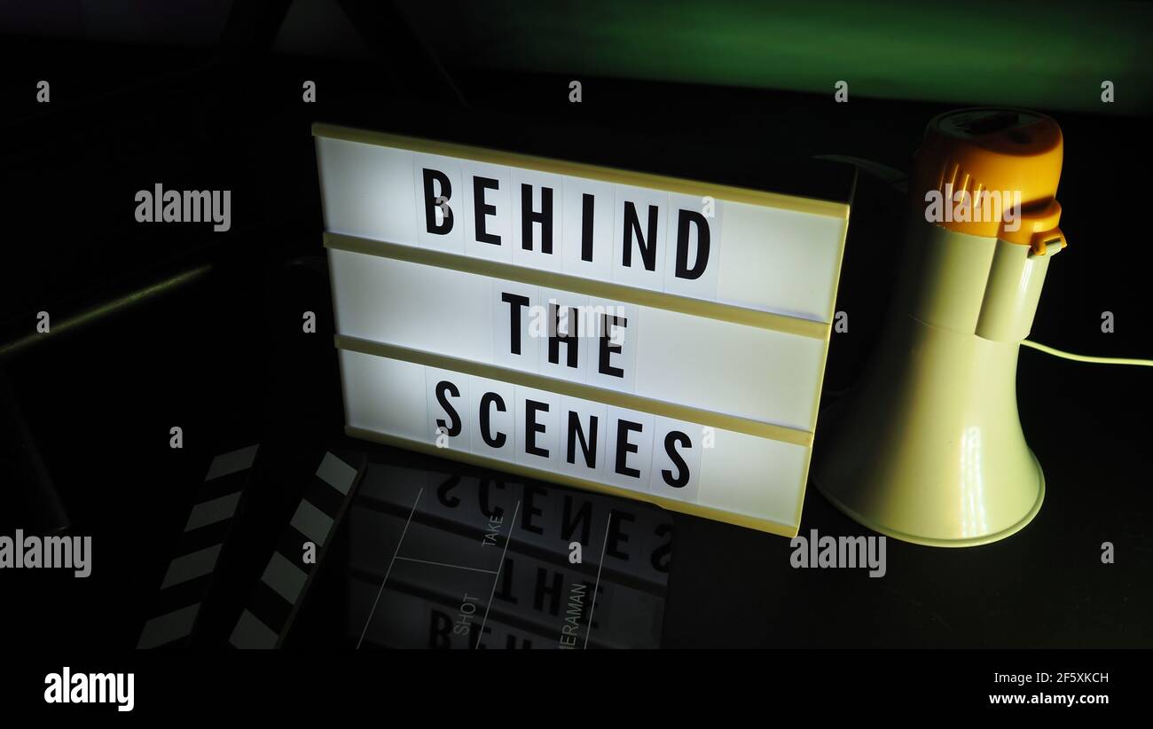 Behind the scenes light box. Text on cinema light box. Megaphone and ...