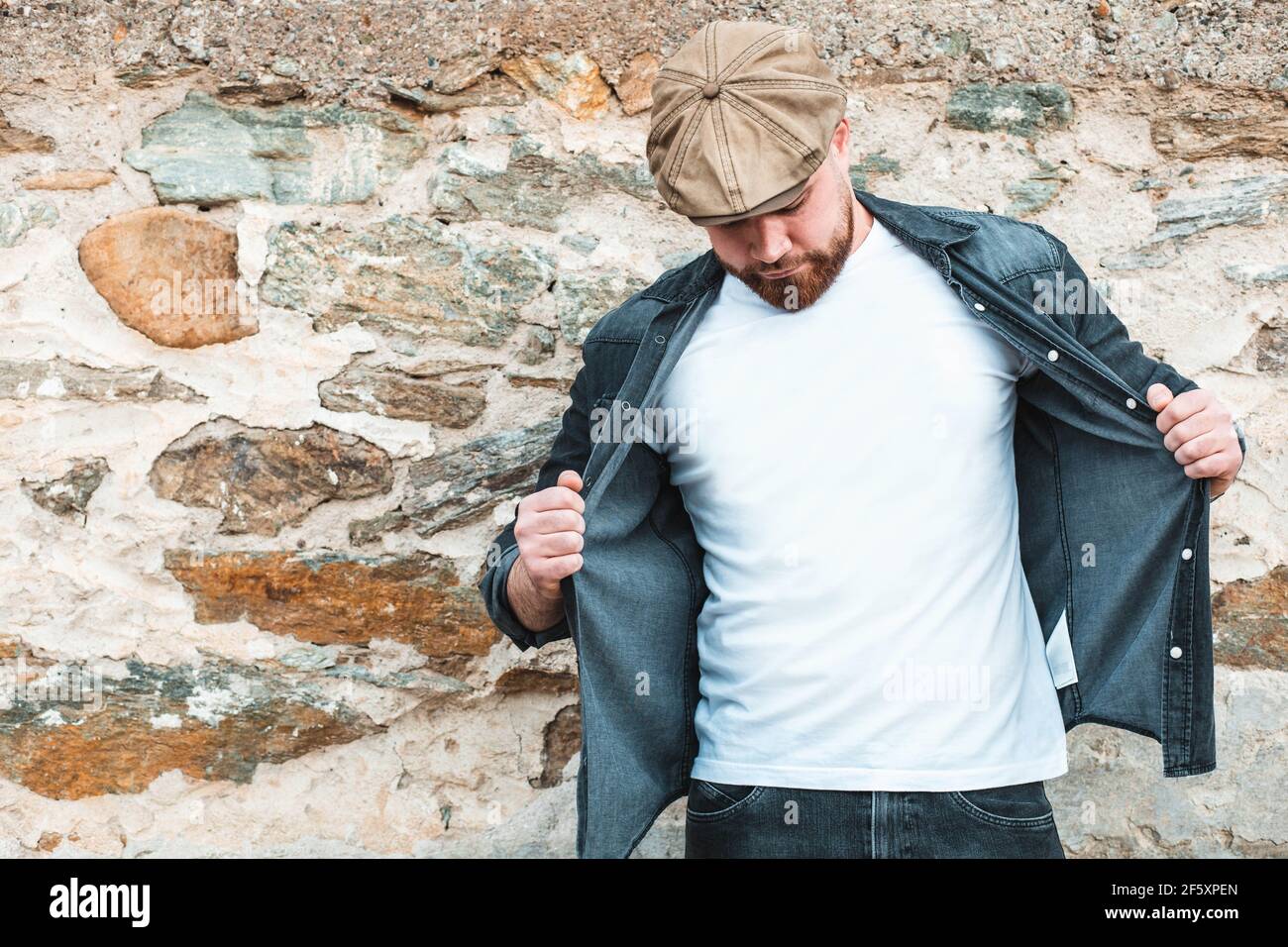 Young, hipster guy wearing a white t-shirt. Empty space Stock Photo