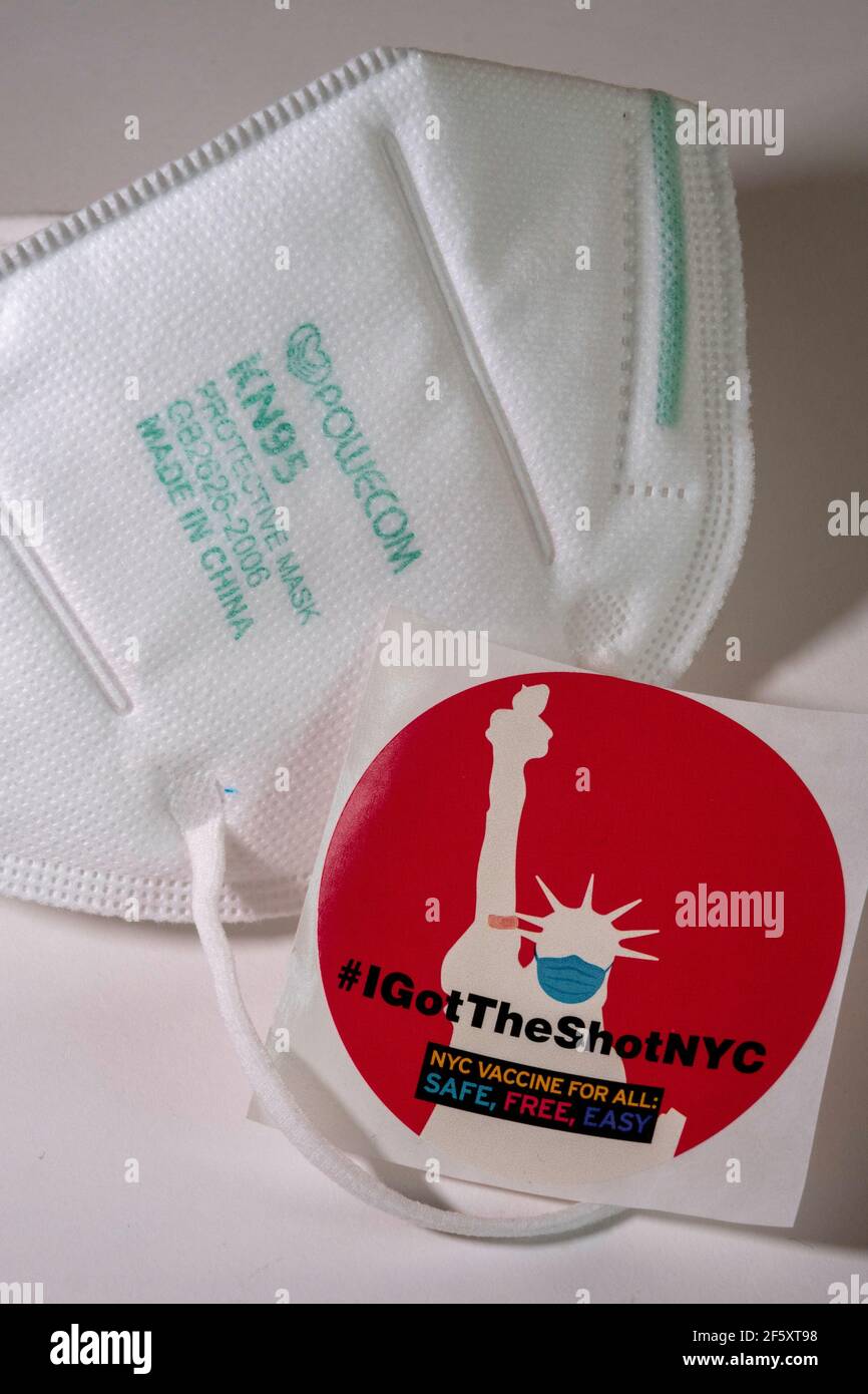 Still Life of #IGotTheShotNYC sticker with KN95 protective face mask, New York City, USA Stock Photo