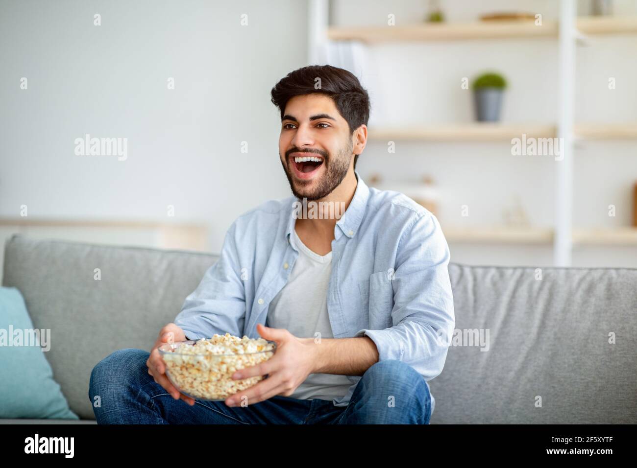 Arab man sitting in sofa hi-res stock photography and images - Alamy
