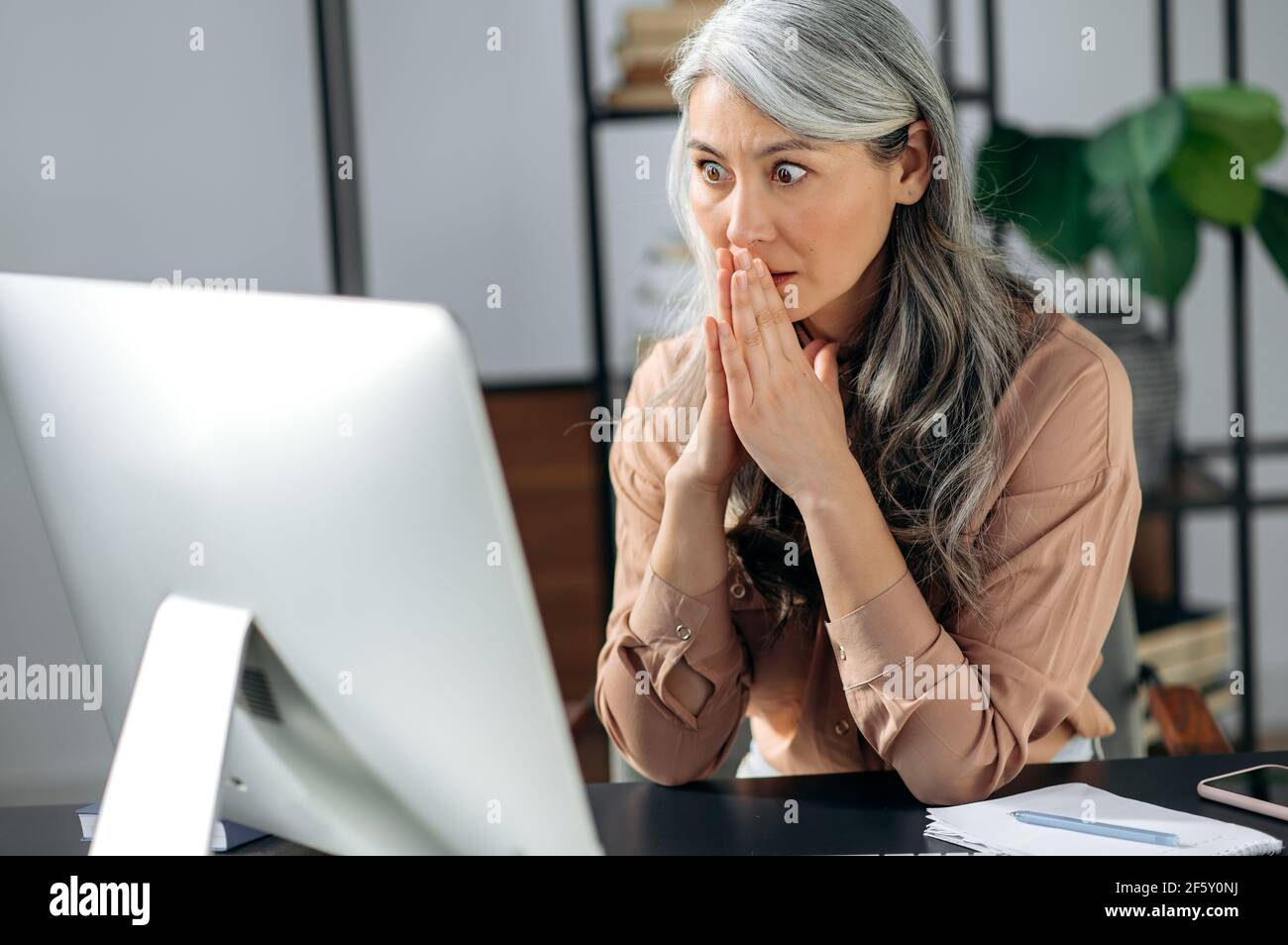 Surprised asian lady sitting hi-res stock photography and images - Alamy