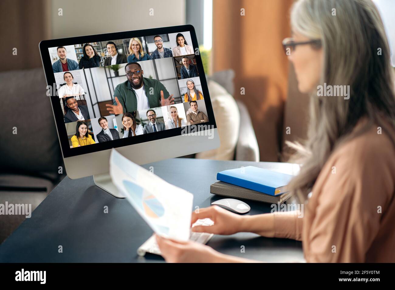 Successful confident beautiful mature gray-haired asian woman wearing  glasses, business lady, ceo, manager, chatting on conference call, online  meeting with interracial business team Stock Photo - Alamy