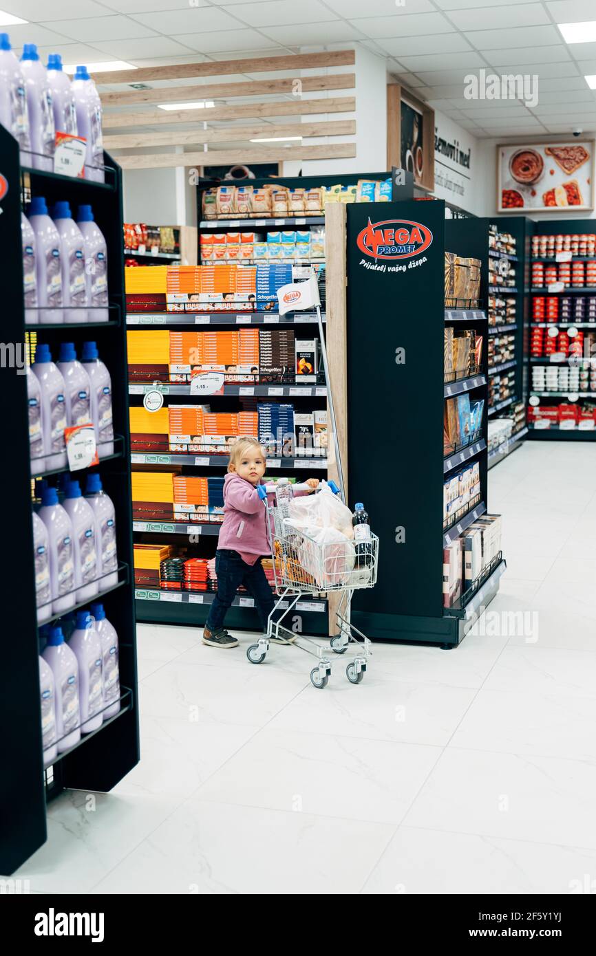 Budva, Montenegro - 17 march 2021: A child with a small trolley in the  supermarket, go shopping with his mother. The family goes shopping Stock  Photo - Alamy