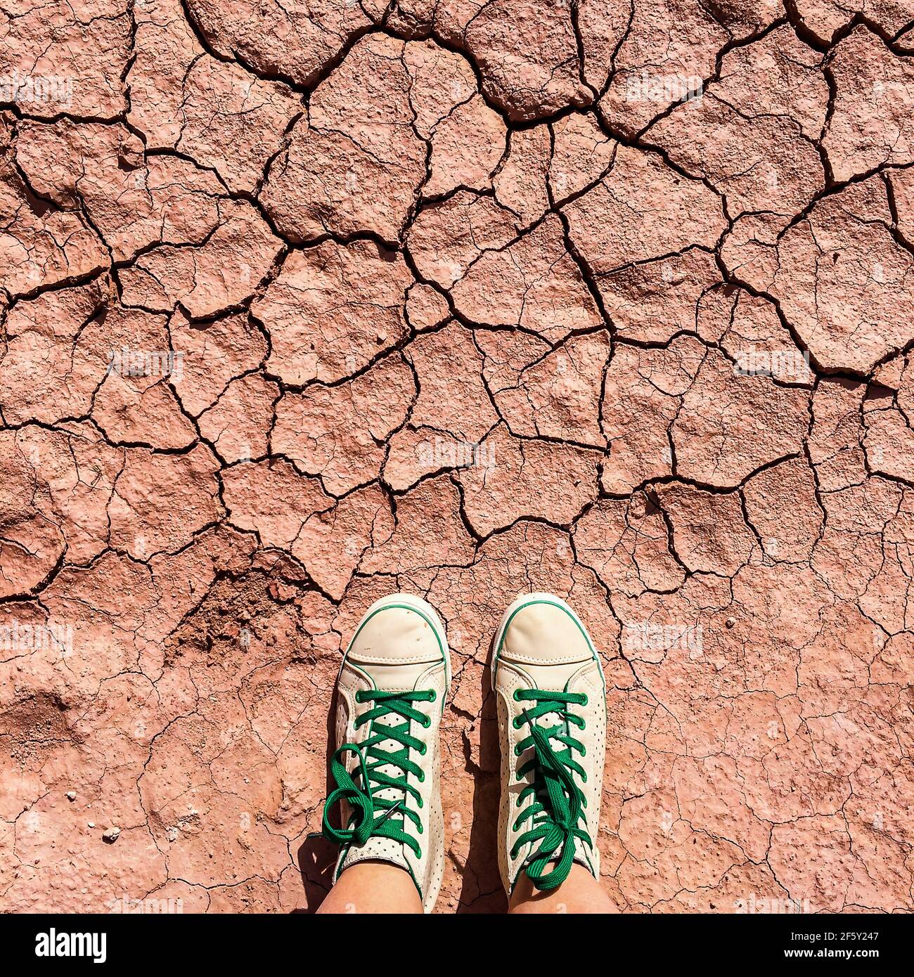 Extremely dry red soil with broken ground Stock Photo Alamy