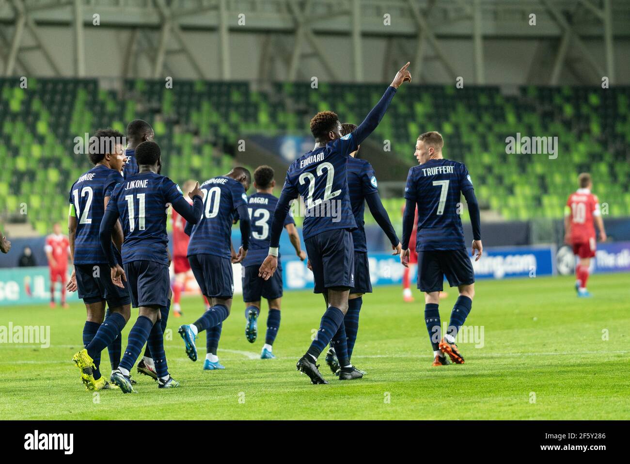 Szombathely, Hungary. 28th Mar, 2021. Odsonne Edouard (22) of France scores for 0-1 from the penalty spot and celebrates witht the team during the UEFA EURO U-21 match between Russia and France at Haladas Stadium in Szombathely. (Photo Credit: Gonzales Photo/Alamy Live News Stock Photo