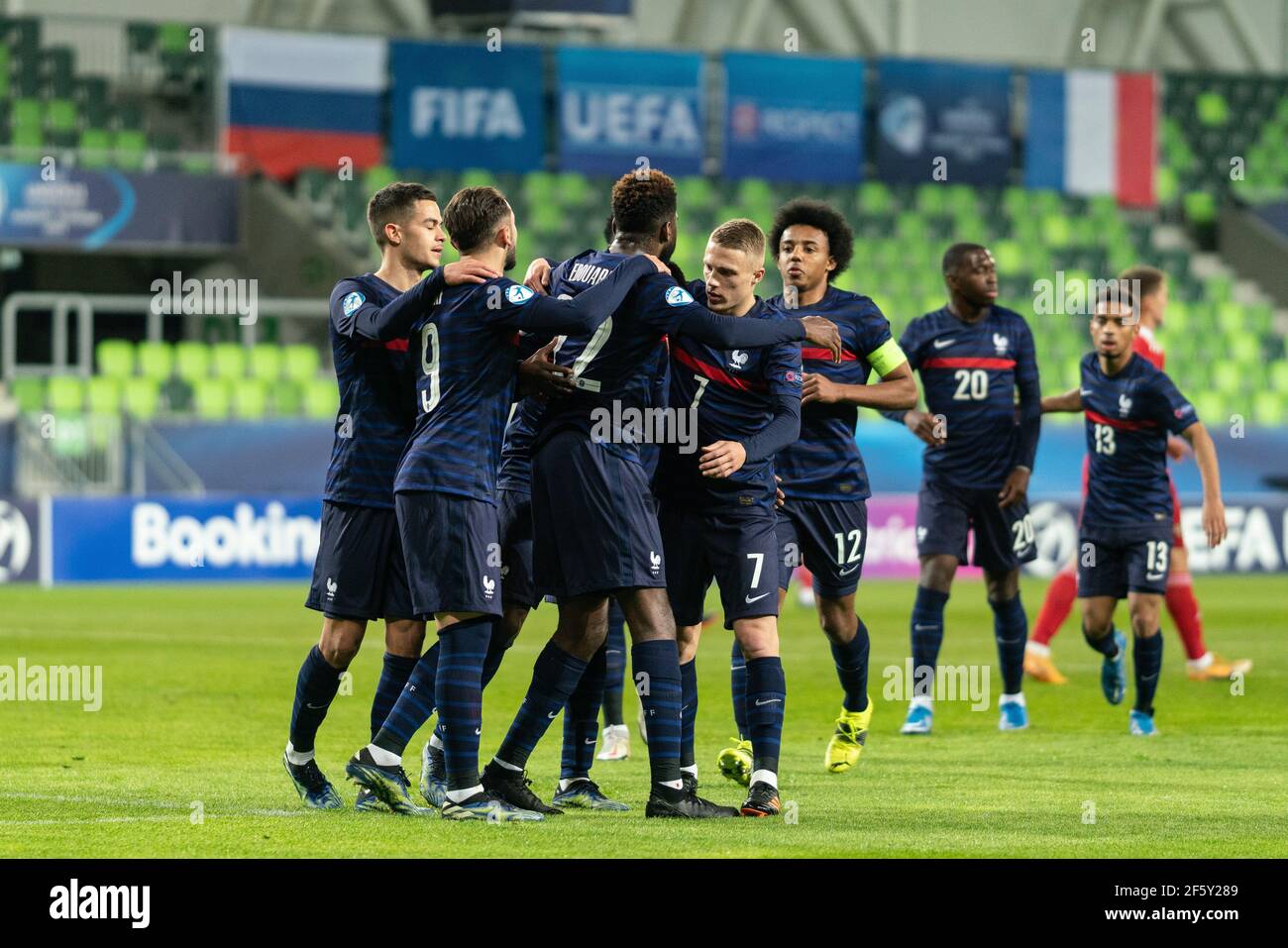 Szombathely, Hungary. 28th Mar, 2021. Odsonne Edouard (22) of France scores for 0-1 from the penalty spot and celebrates witht the team during the UEFA EURO U-21 match between Russia and France at Haladas Stadium in Szombathely. (Photo Credit: Gonzales Photo/Alamy Live News Stock Photo