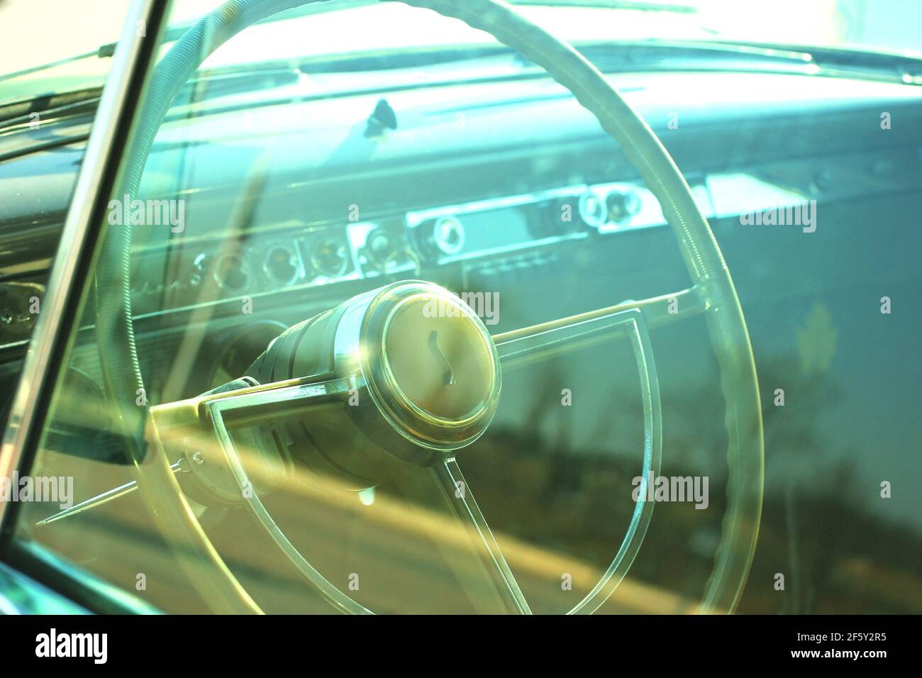 Classic Car Automobile Interior with Steering wheel and dashboard Stock Photo