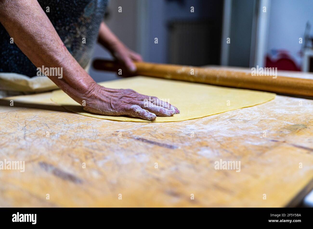 detail roll out the dough with a rolling pin Stock Photo