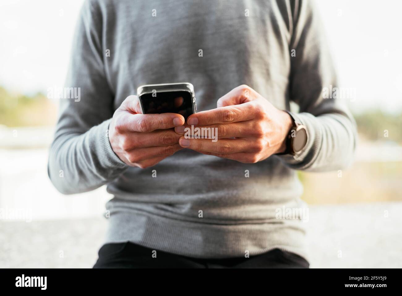 Close-up of a man using smartphone Stock Photo