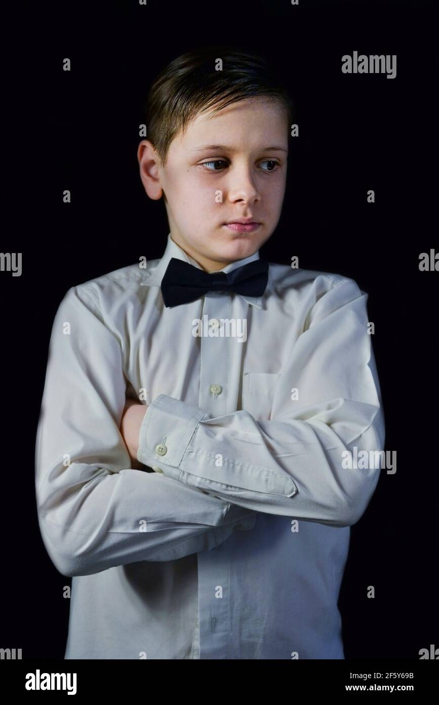 portrait of boy with arms crossed on the chest Stock Photo Alamy
