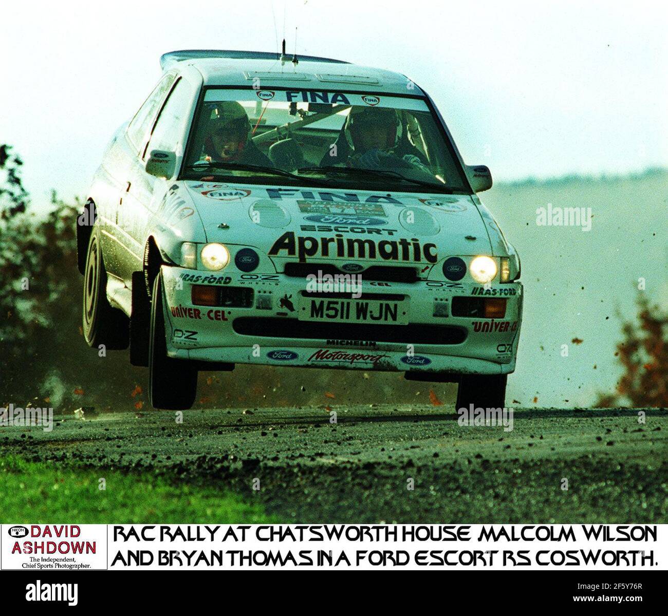 Malcom Wilson and Bryan Thomas land heavily in their Ford Escort Cosworth after clearing a crest of a hill in the Network Q RAC Rally at Chatsworth House Stock Photo
