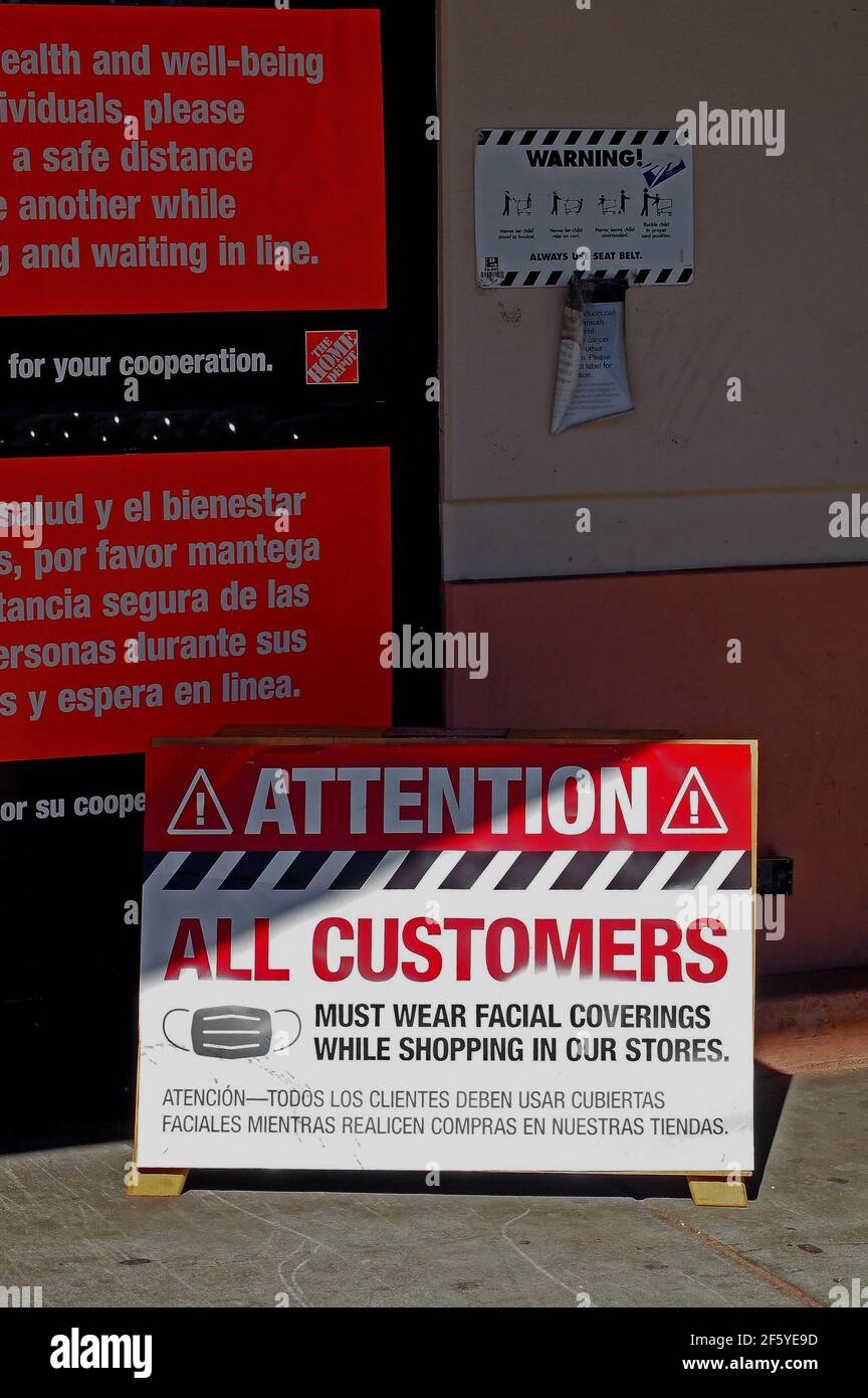 Attention all customers must wear facial coverings while shopping in our store sign at entrance to the Home Depot store in Union City, California, Stock Photo