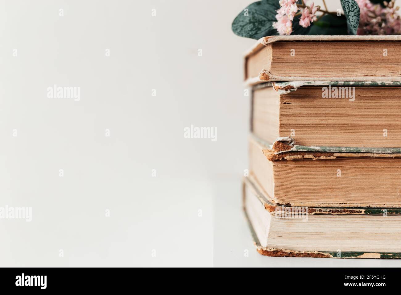 A stack of old books in the library, concept of learning, study and education, concept of science, wisdom and knowledge. High quality photo Stock Photo