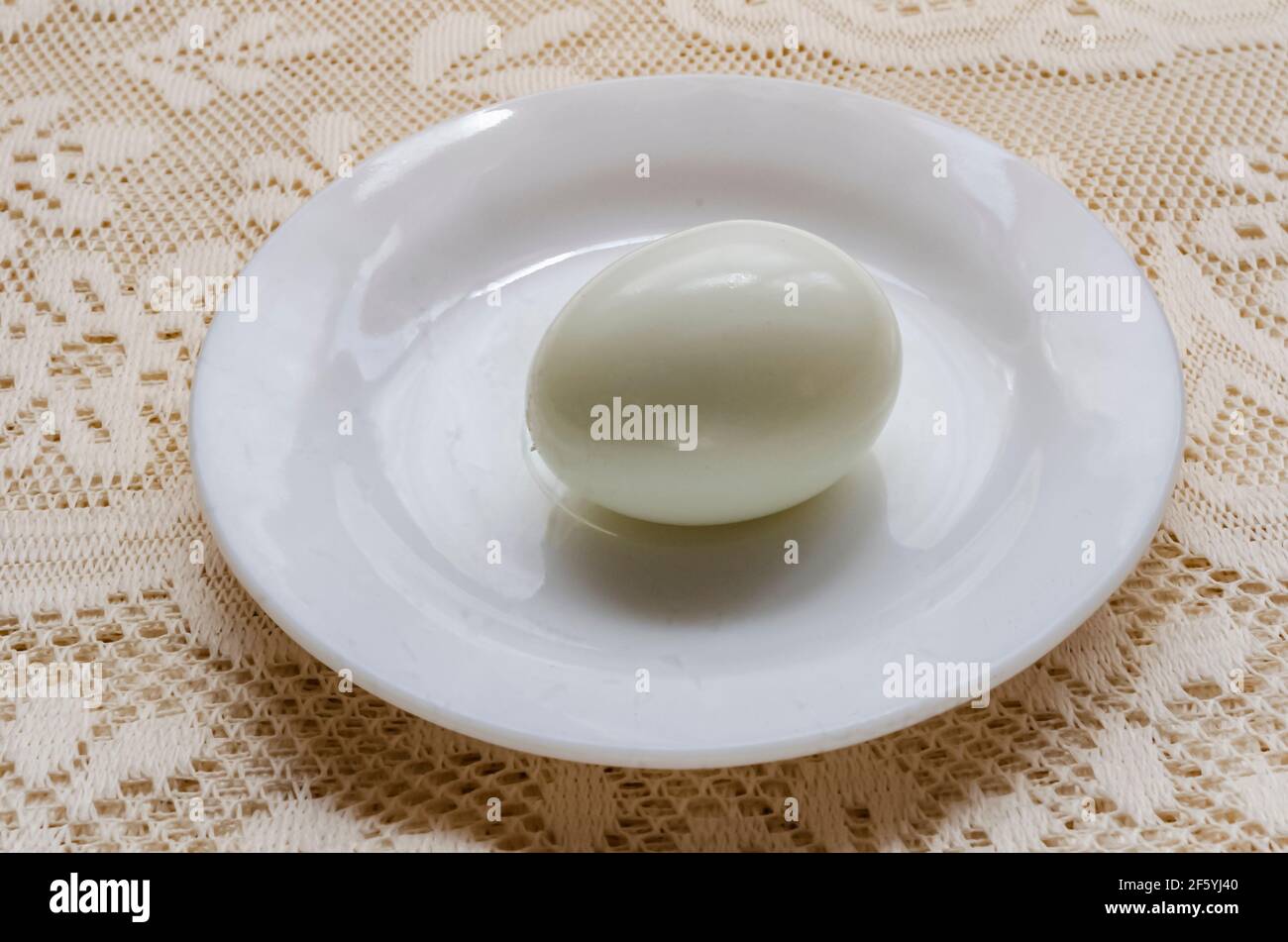 Stripped Whole Boiled Egg In Saucer Stock Photo Alamy