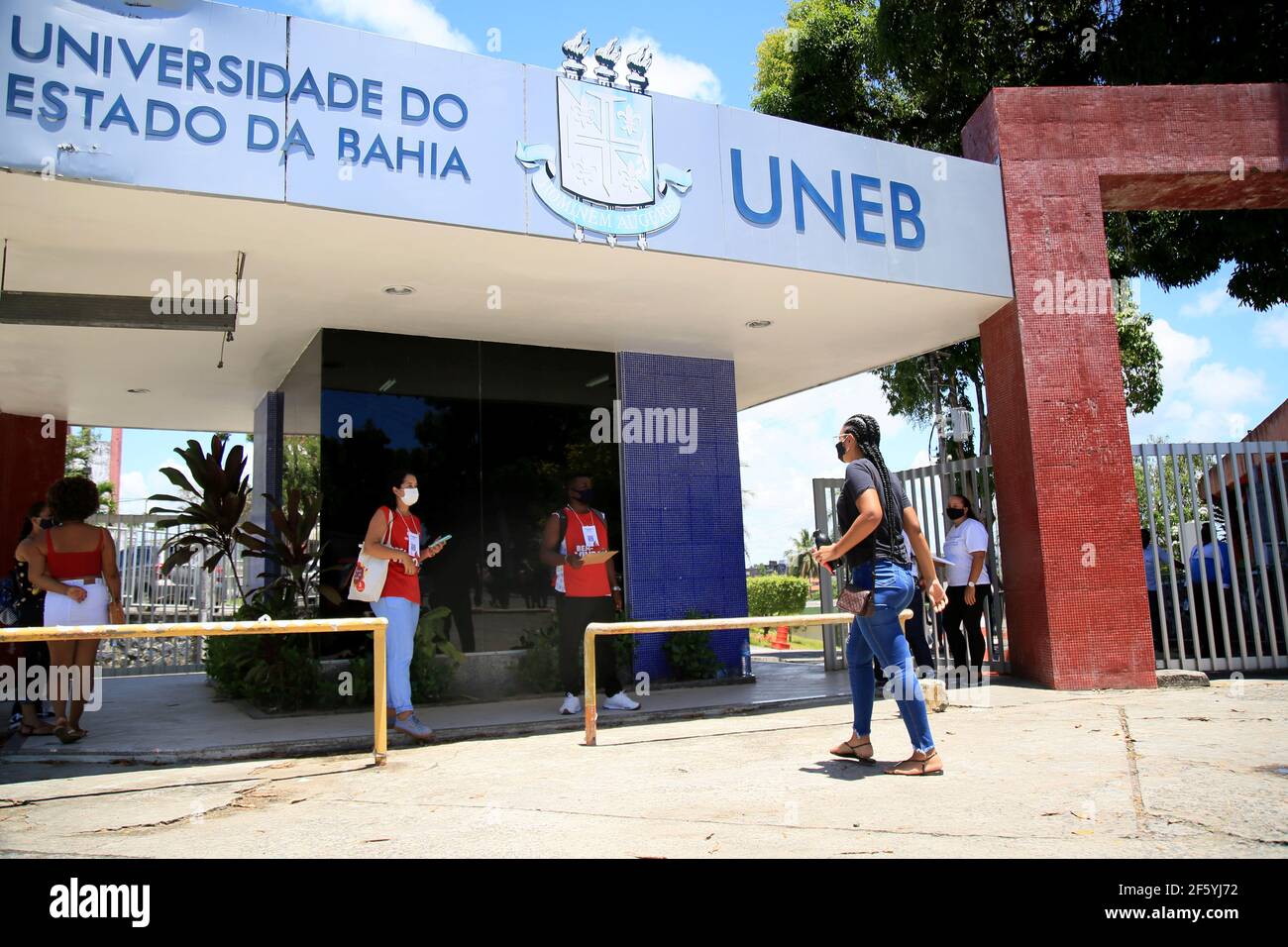 salvador, bahia, brazil - january 17, 2021: Candidates for the National High School Examination exam - Enem, are seen entering the gate of the State U Stock Photo