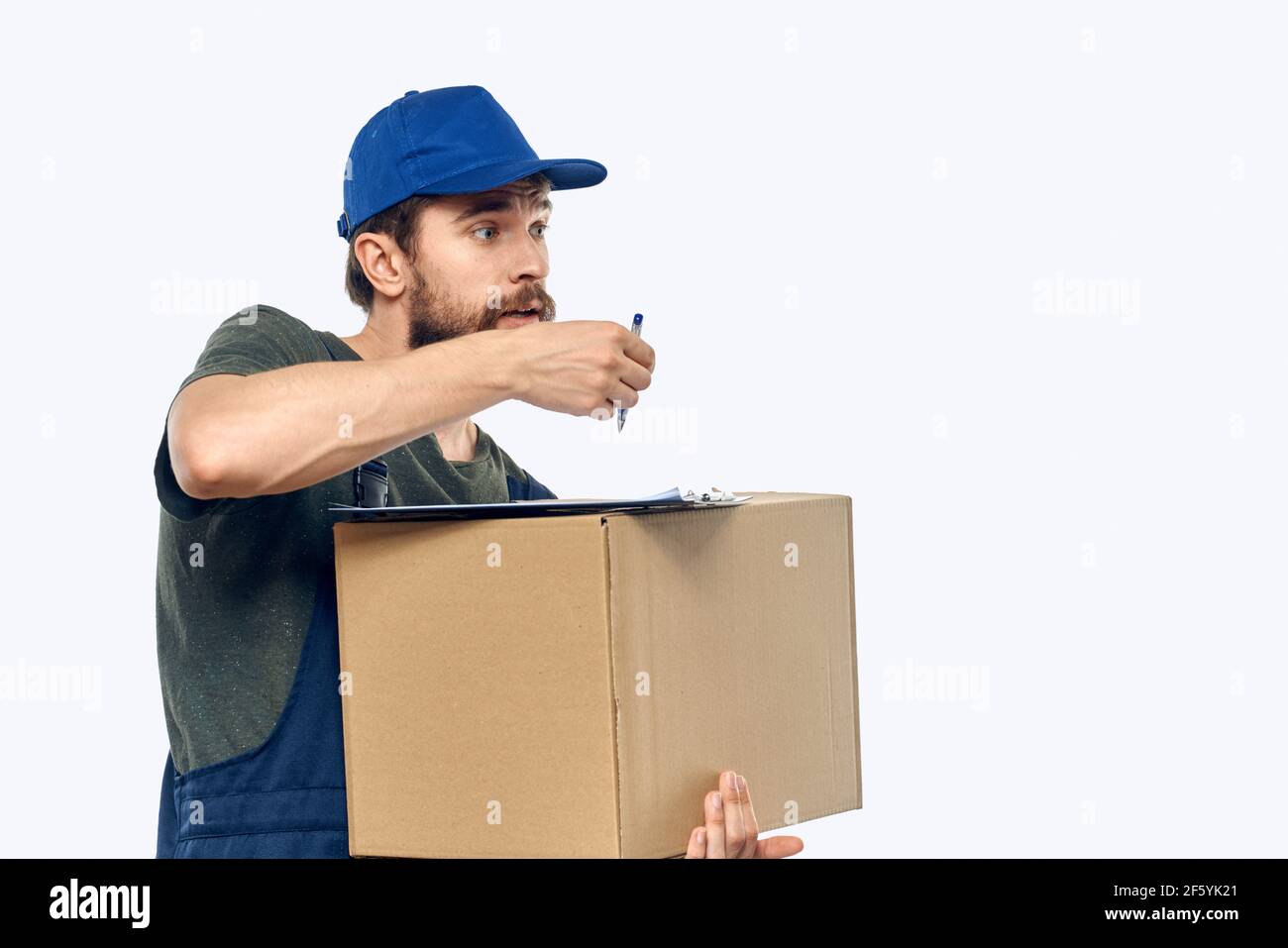 male working uniform box delivery by courier professional Stock Photo ...