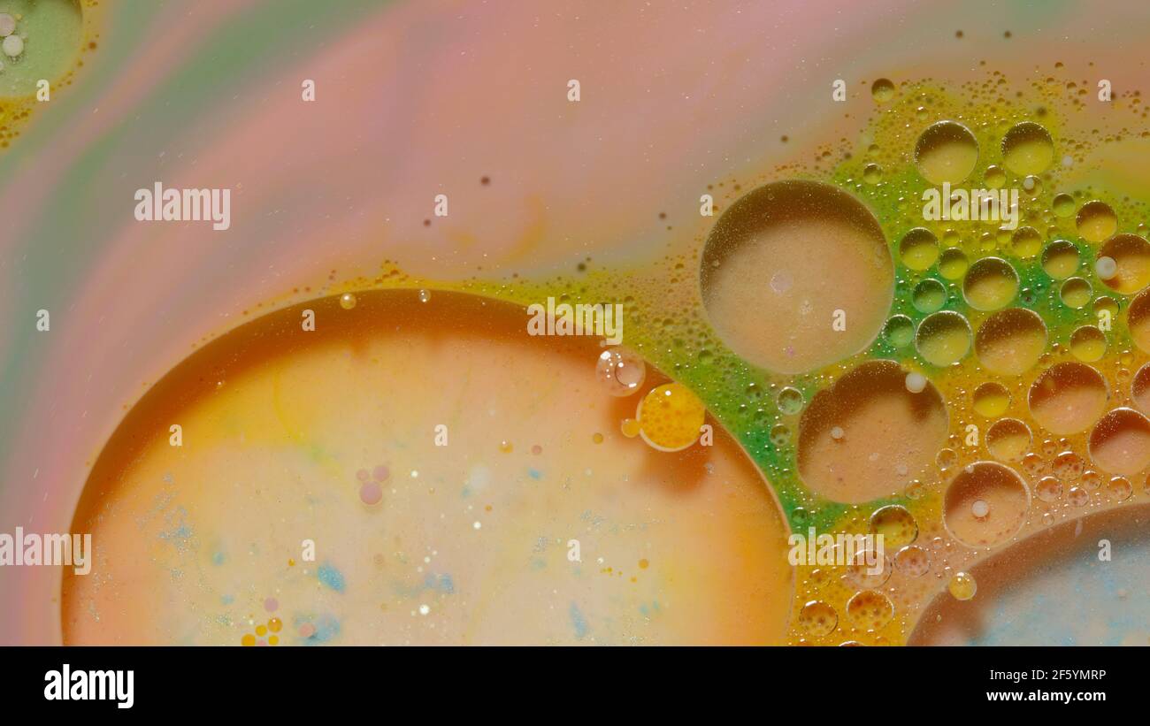 Ink bubbles mixed with liquid substance of oil, milk, soap, bright