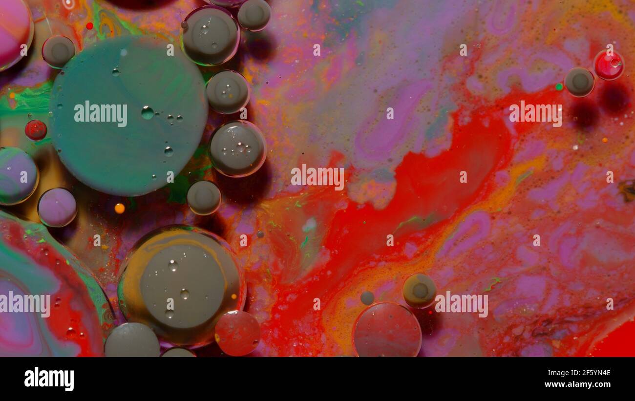 Ink bubbles mixed with liquid substance of oil, milk, soap, bright