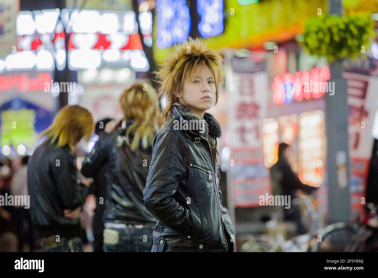 Japanese male host touting for business on the streets of Shinjuku, Tokyo, Japan Stock Photo