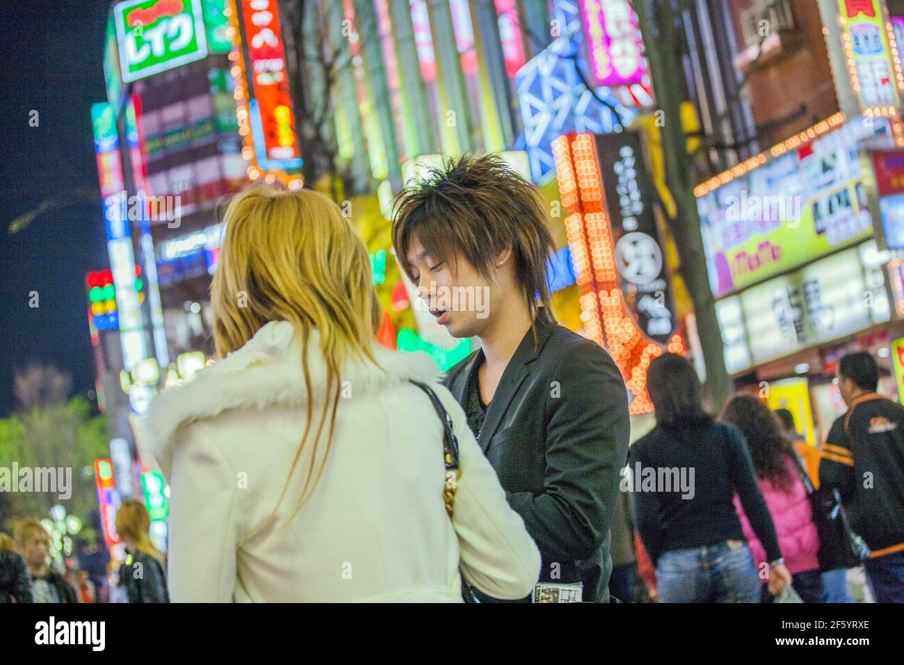 Japanese male host touting for business on the streets of Kabukicho, Shinjuku, Tokyo, Japan Stock Photo