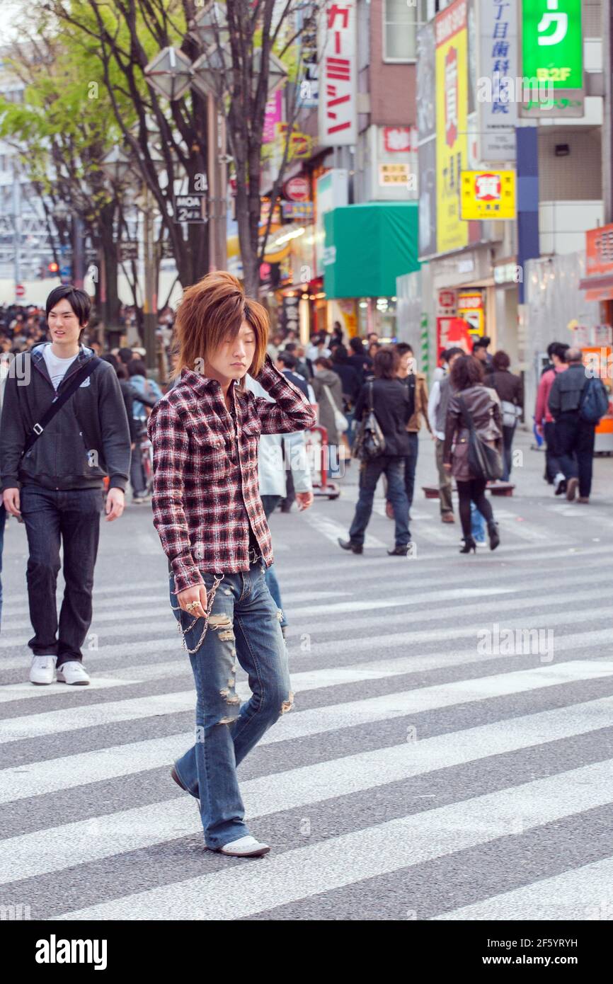 Japanese male host touting for business on the streets of Shinjuku, Tokyo, Japan Stock Photo