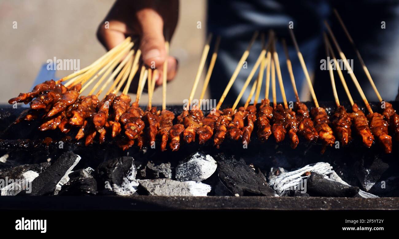 Chicken Satay ( ayam sate ) is a signature street food dish in Indonesia. Stock Photo
