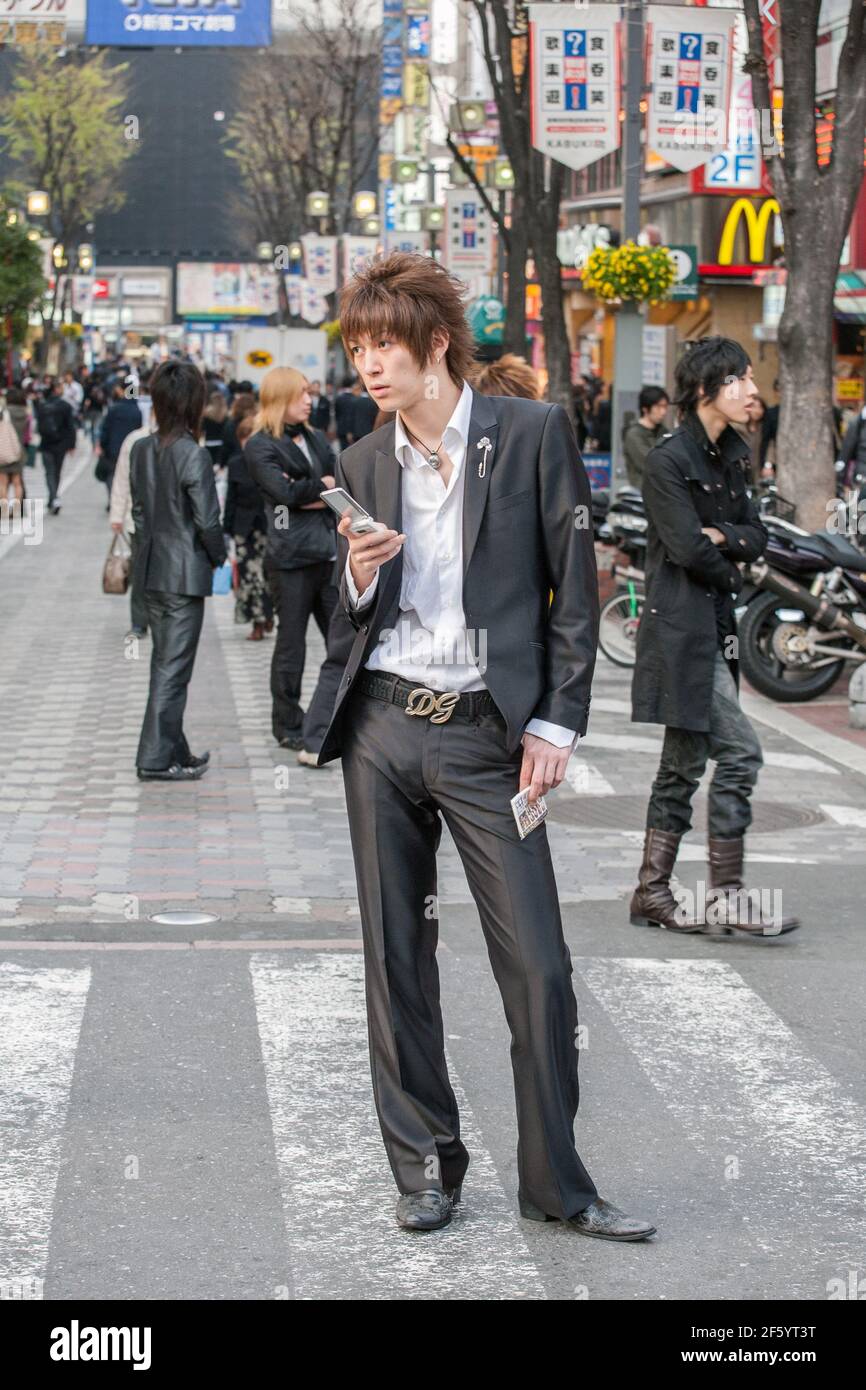 Japanese male host wearing suit touting for business on the streets of Shinjuku, Tokyo, Japan Stock Photo