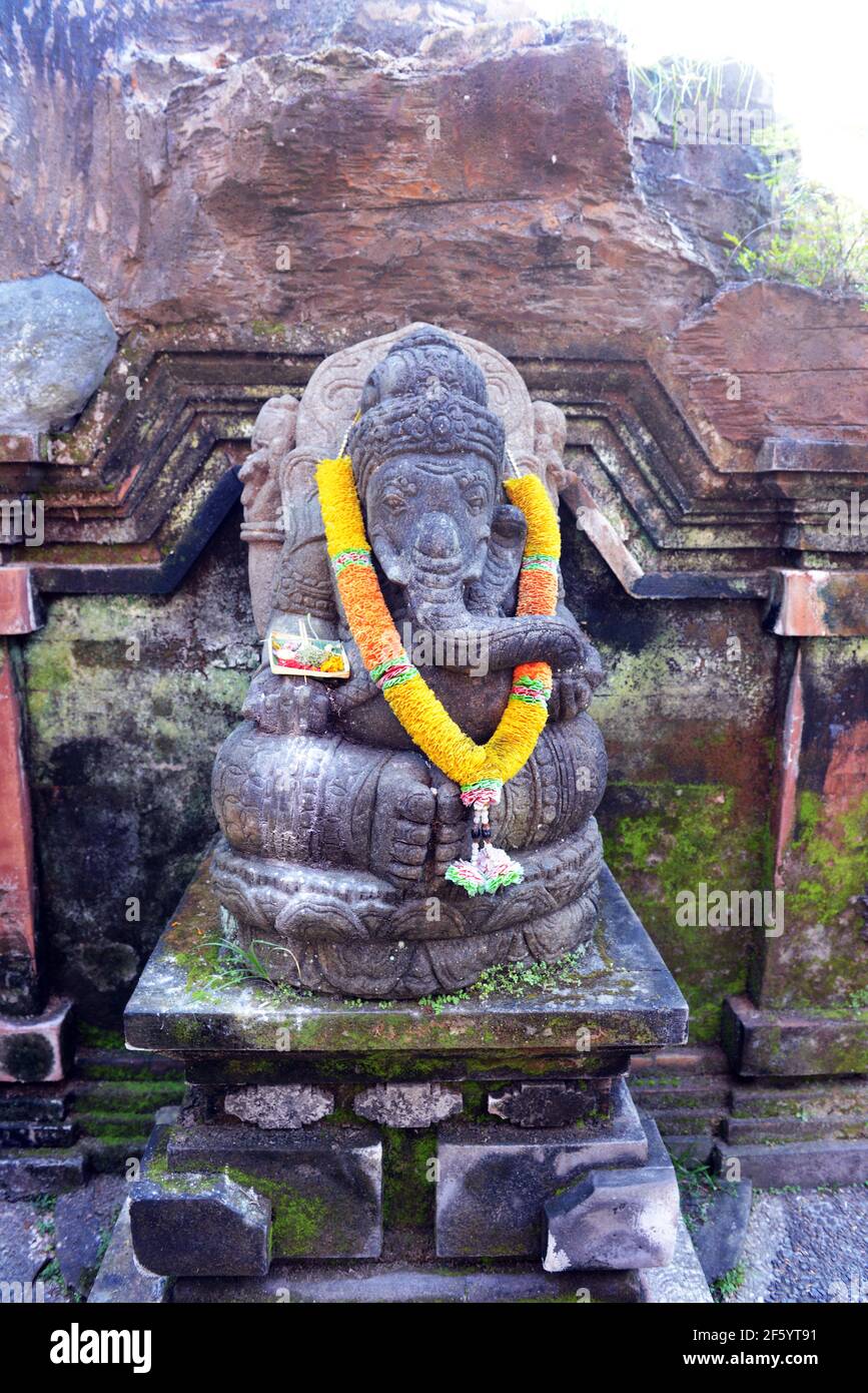 A rock carved statue of the Hindu got Ganesh in a temple in Ubud, Indonesia. Stock Photo