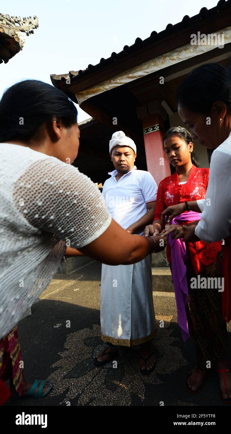 A Pre marriage blessing ceremony in a small Hindu temple in Ubud, Bali