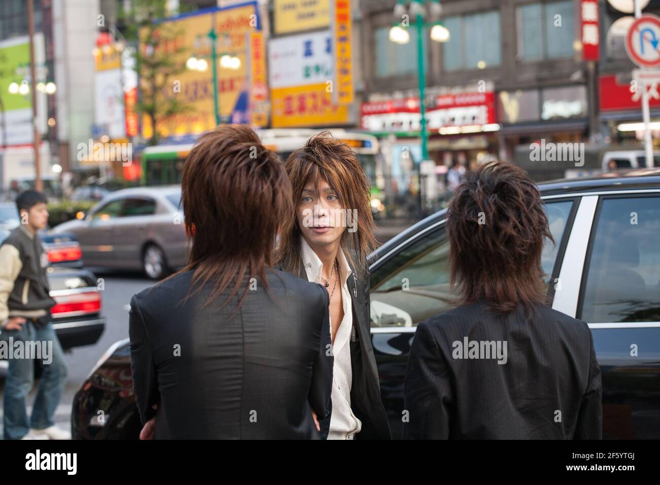 Japanese male hosts touting for business on the streets of Shinjuku, Tokyo, Japan Stock Photo