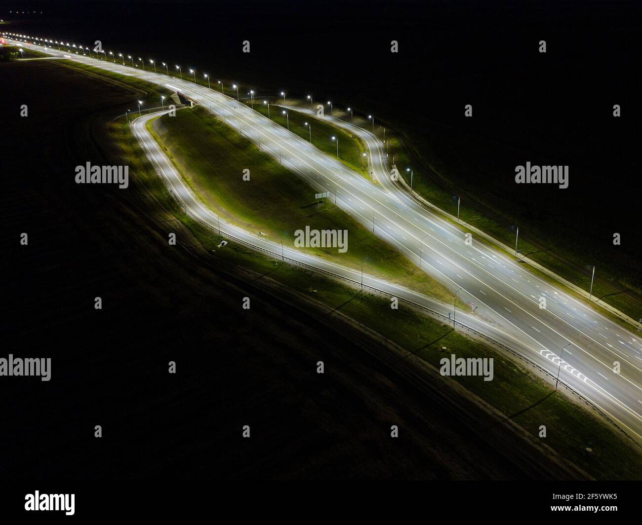 Night roads panoramic background, bird eye view on illuminated highway ...