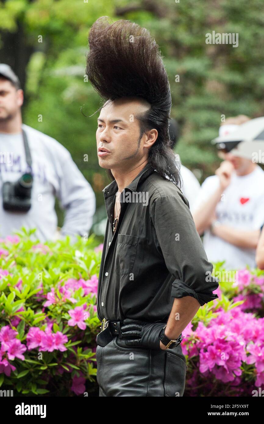 Close up of Japanese rockabilly with huge pompadour/quiff posing in Yoyogi Park, Harajuku, Tokyo, Japan Stock Photo