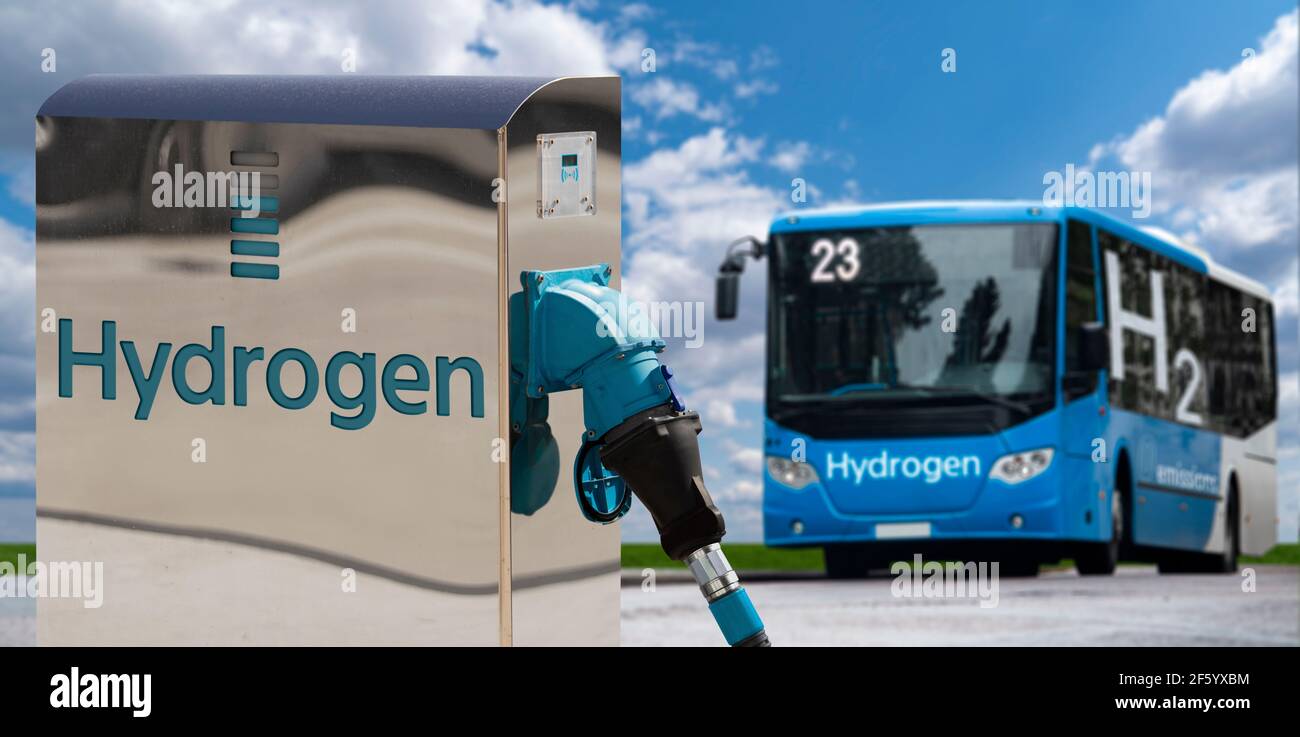 Tourist bus on hydrogen fuel with H2 filling station on a background of green field and blue sky Stock Photo