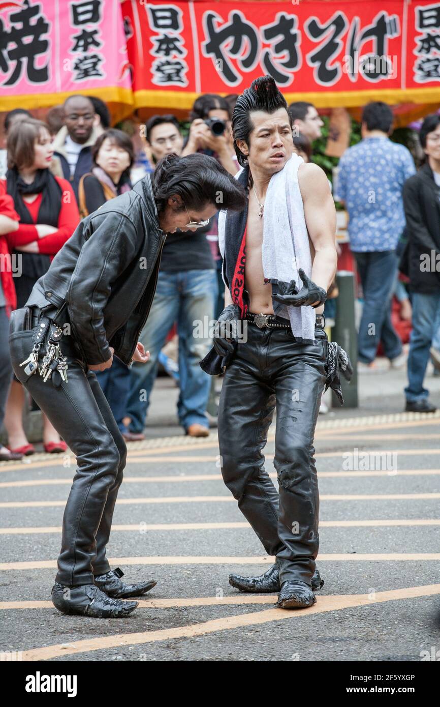 Japanese Rockabillies in leather pants with quiffs dancing in