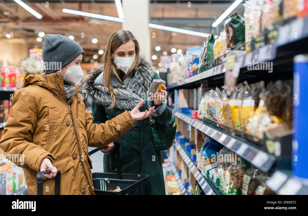 Family shopping in supermarket during covind19 pandemic Stock Photo