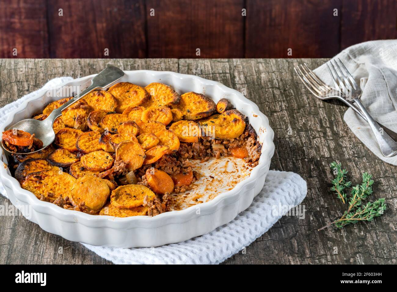 Cottage pie with sweet potato medallions topping Stock Photo