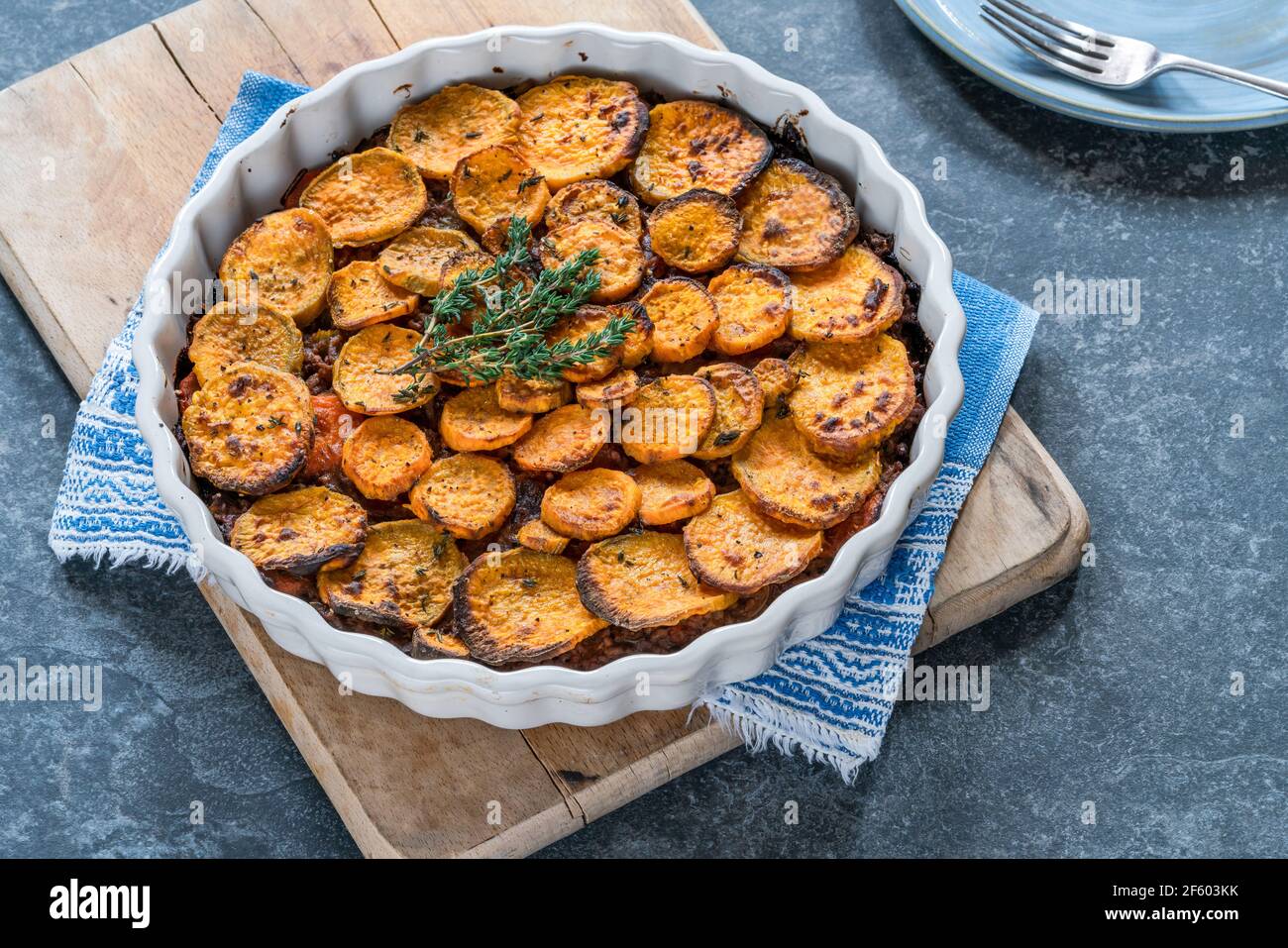 Cottage pie with sweet potato medallions topping Stock Photo