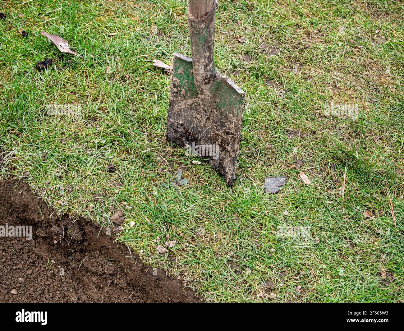 Shovel stuck in grass hi-res stock photography and images - Alamy