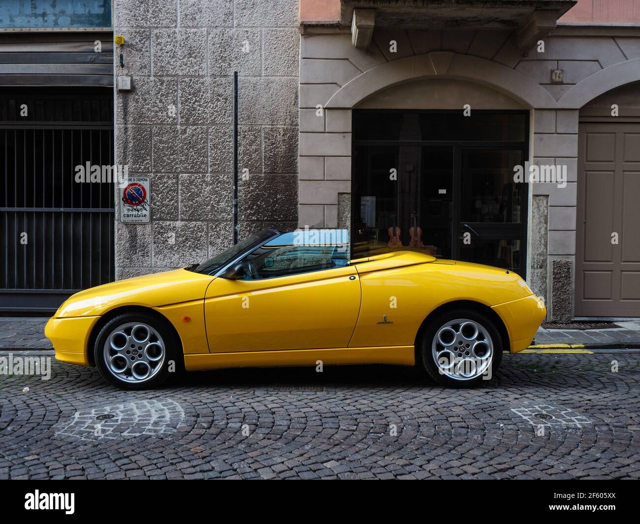 yellow Alfa Romeo Spider GTV cabriolet roadster Stock Photo - Alamy
