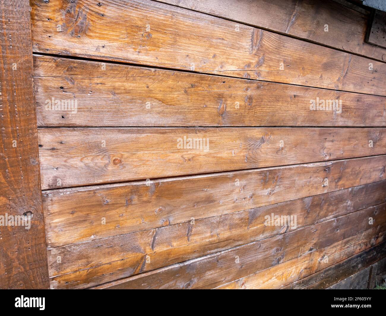 Woodshed is freshly painted with wood protection Stock Photo