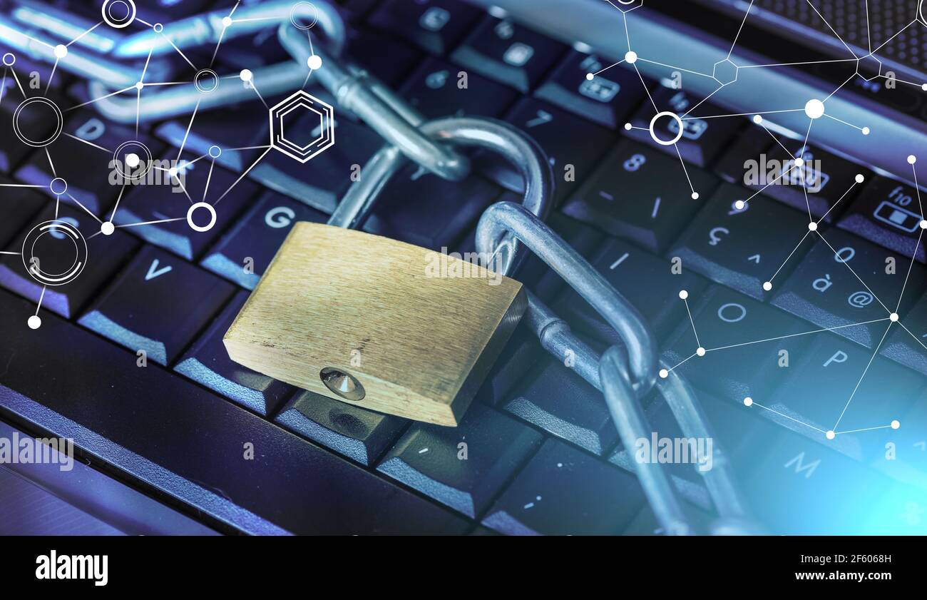 Computer security concept with a padlock and a chain on a keyboard ...
