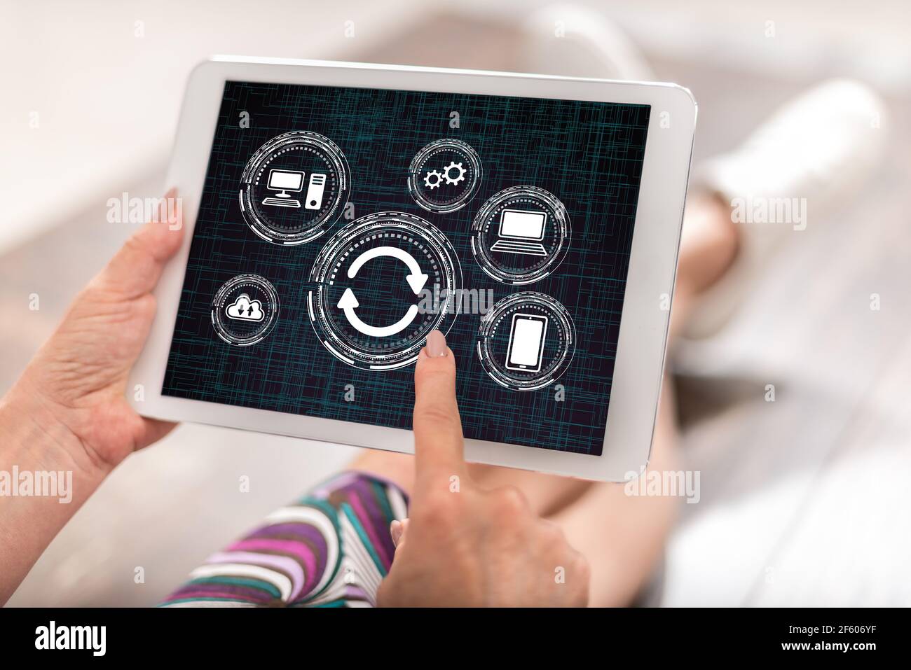 Woman using a tablet with system update concept Stock Photo