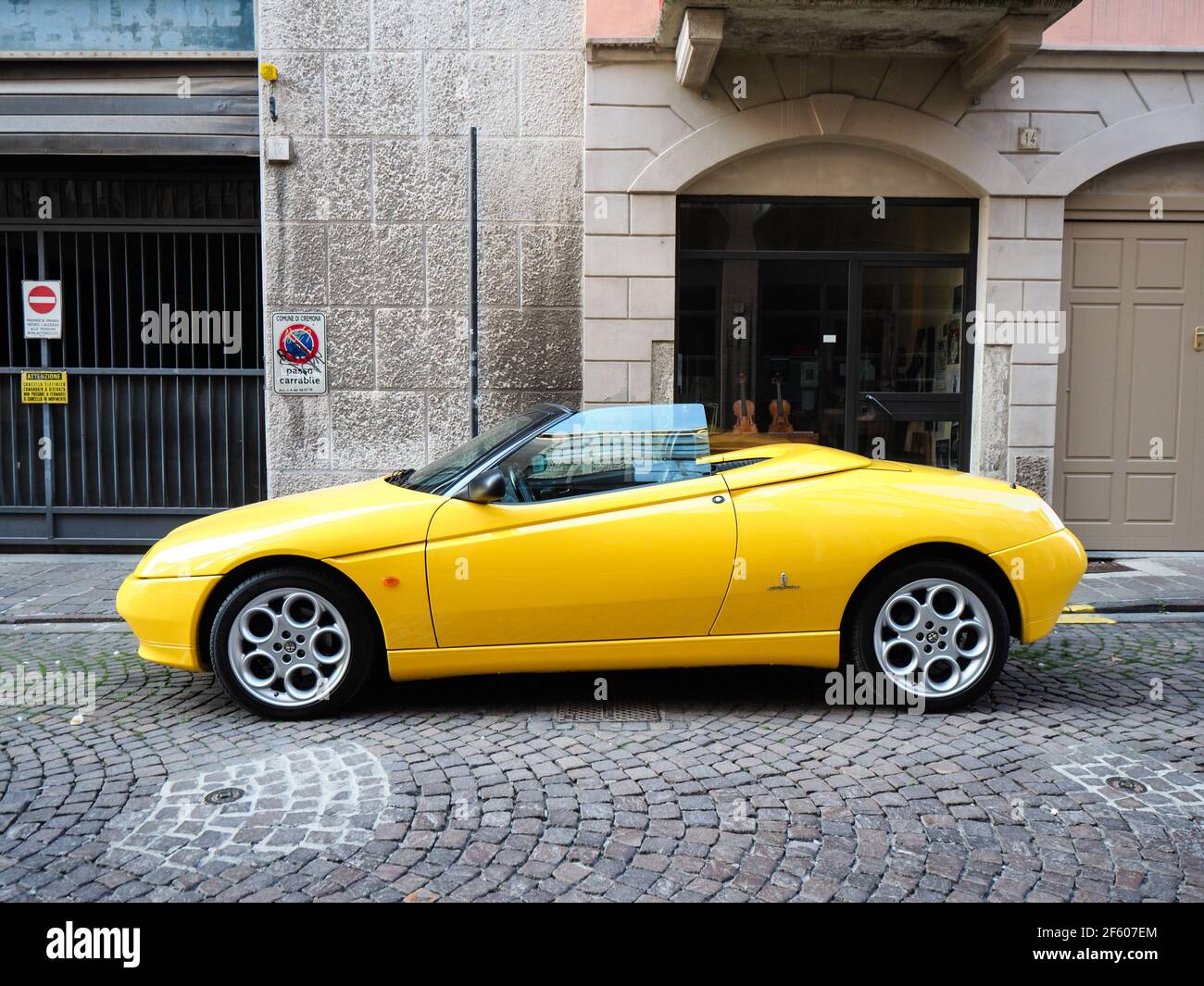 yellow Alfa Romeo Spider GTV cabriolet roadster Stock Photo - Alamy