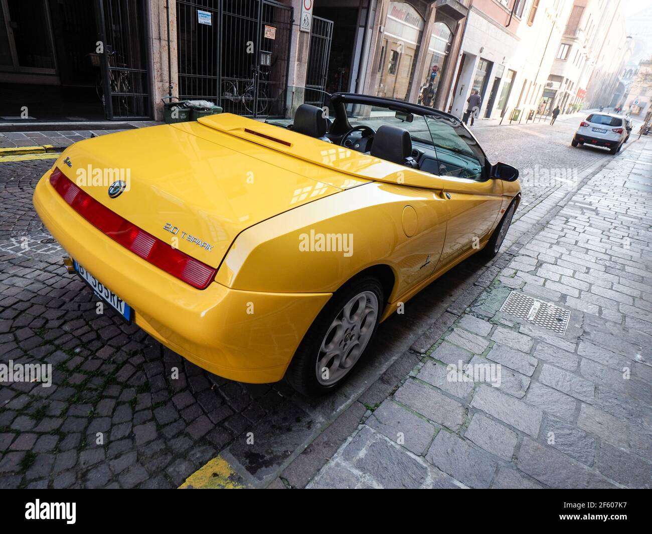 yellow Alfa Romeo Spider  GTV cabriolet roadster Stock Photo