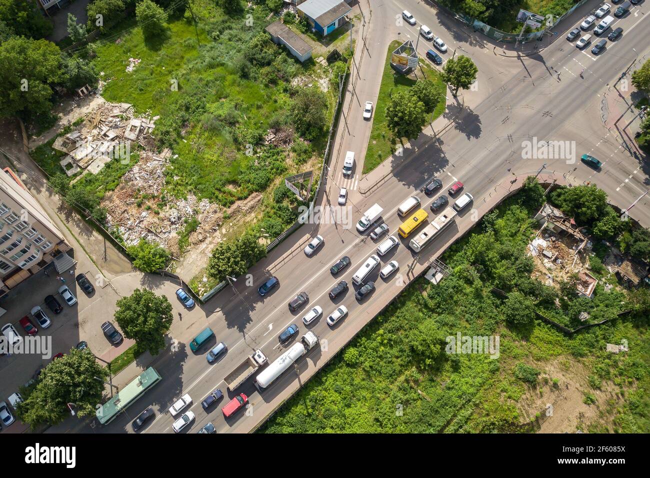 Top down aerial view of busy street intersection with moving cars ...