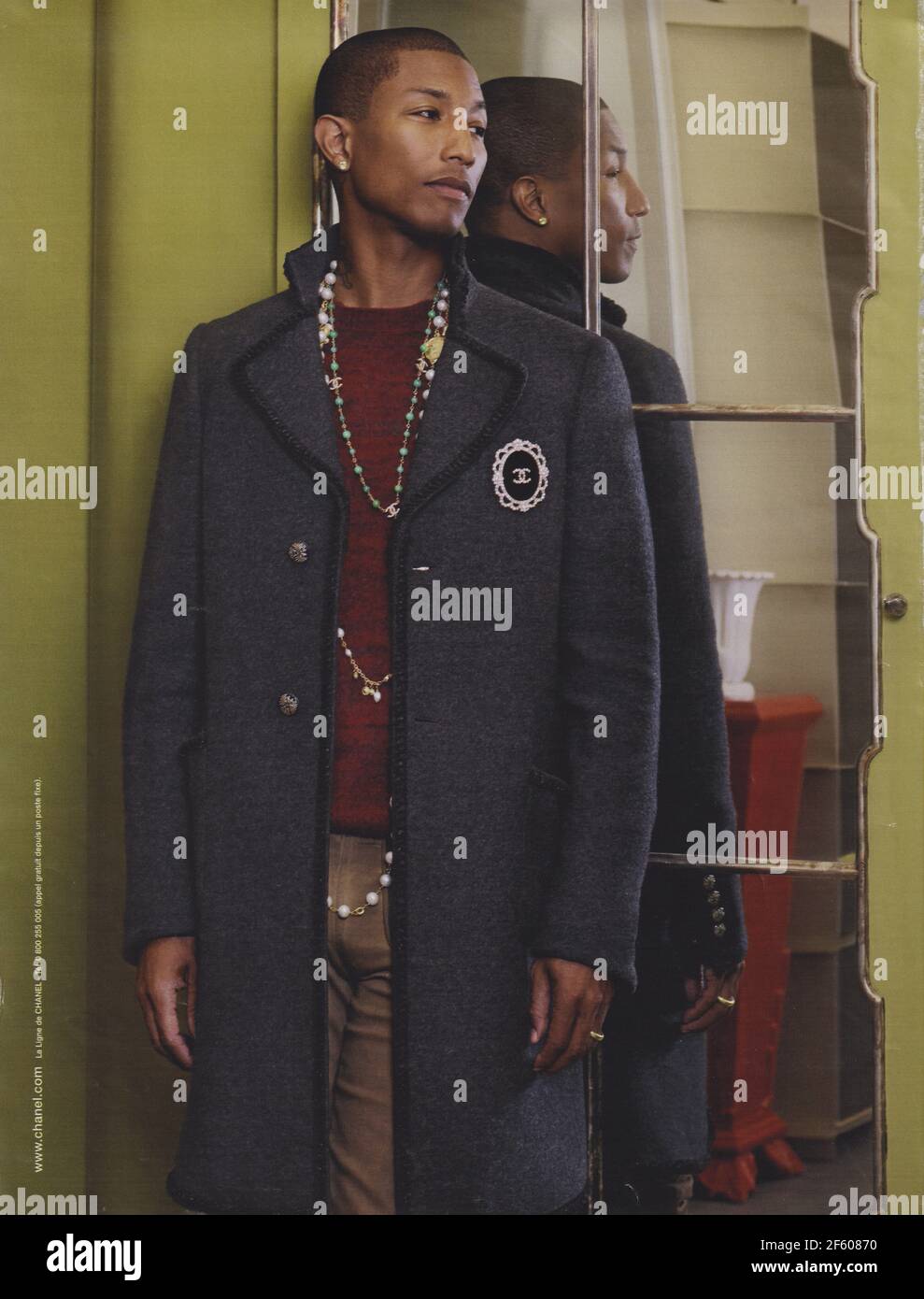 poster advertising CHANEL fashion house with Pharrell Williams in paper magazine from 2015 year, advertisement, creative CHANEL advert from 2010s Stock Photo