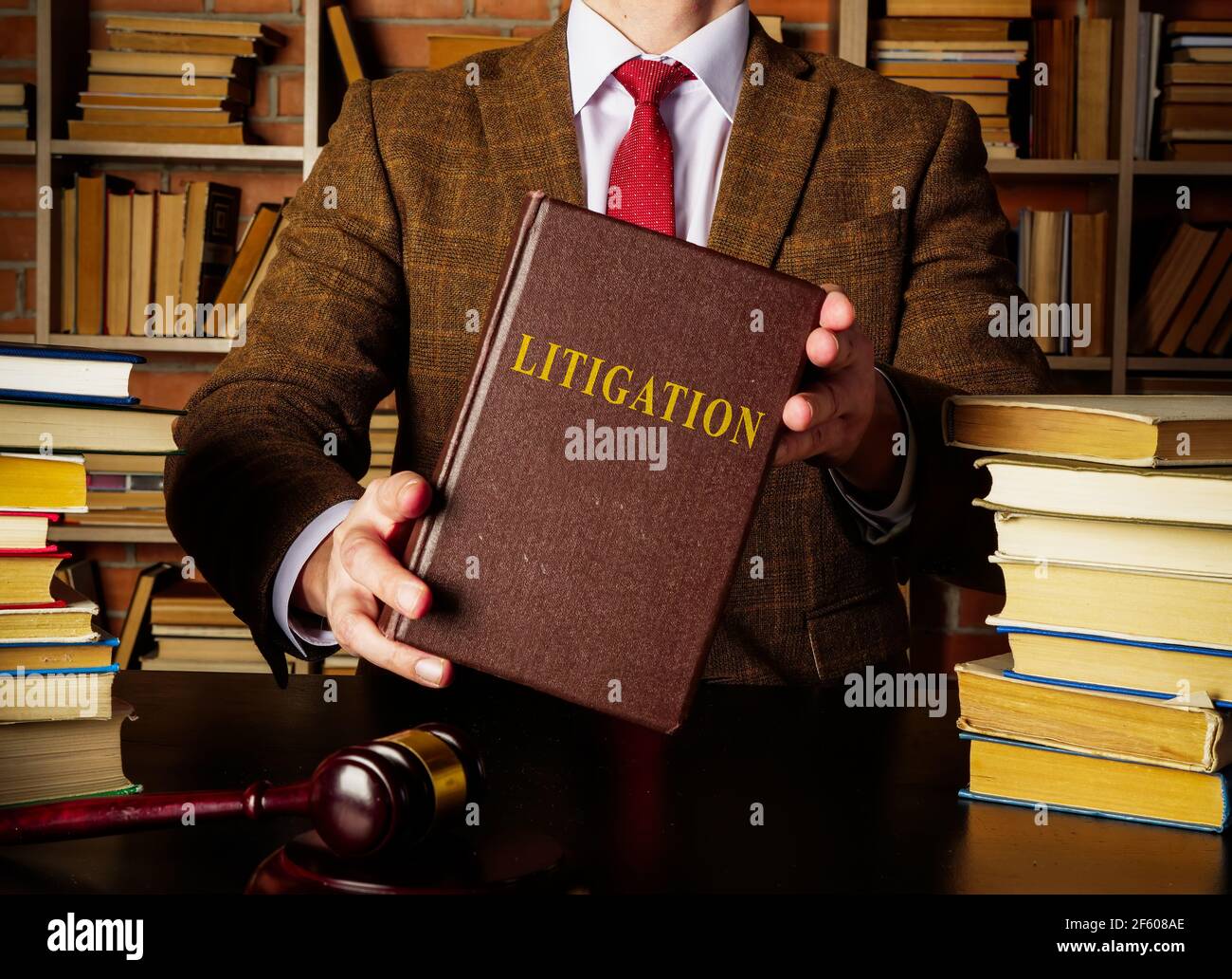 Book about Litigation in the lawyer hands. Stock Photo