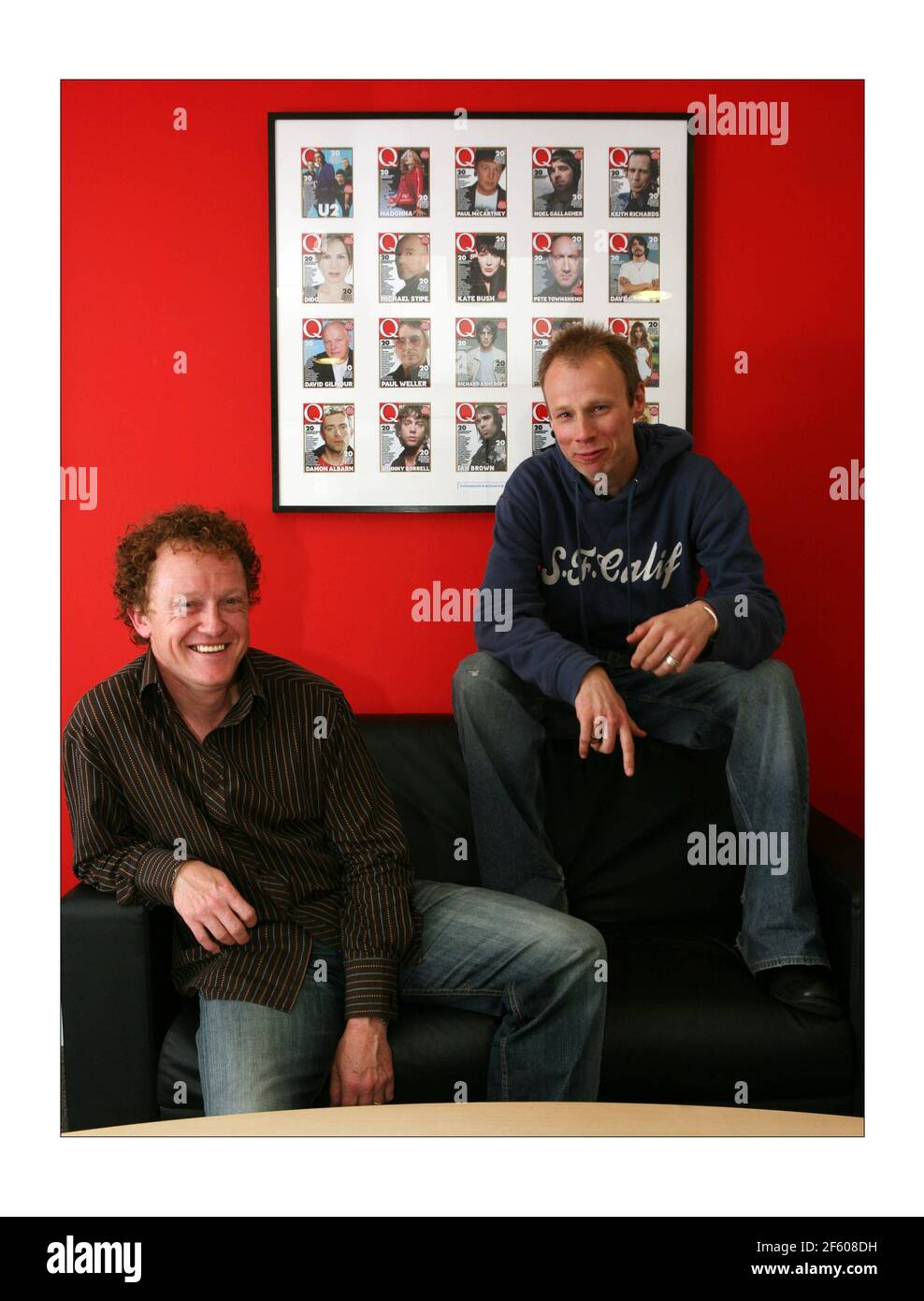 Q Radio.... Paul Rees (short hair, blue top) Editor of Q magazine and Rick  Blaxill (curly hair, brown top) Program Director Q  by  David Sandison The Independent Stock Photo - Alamy