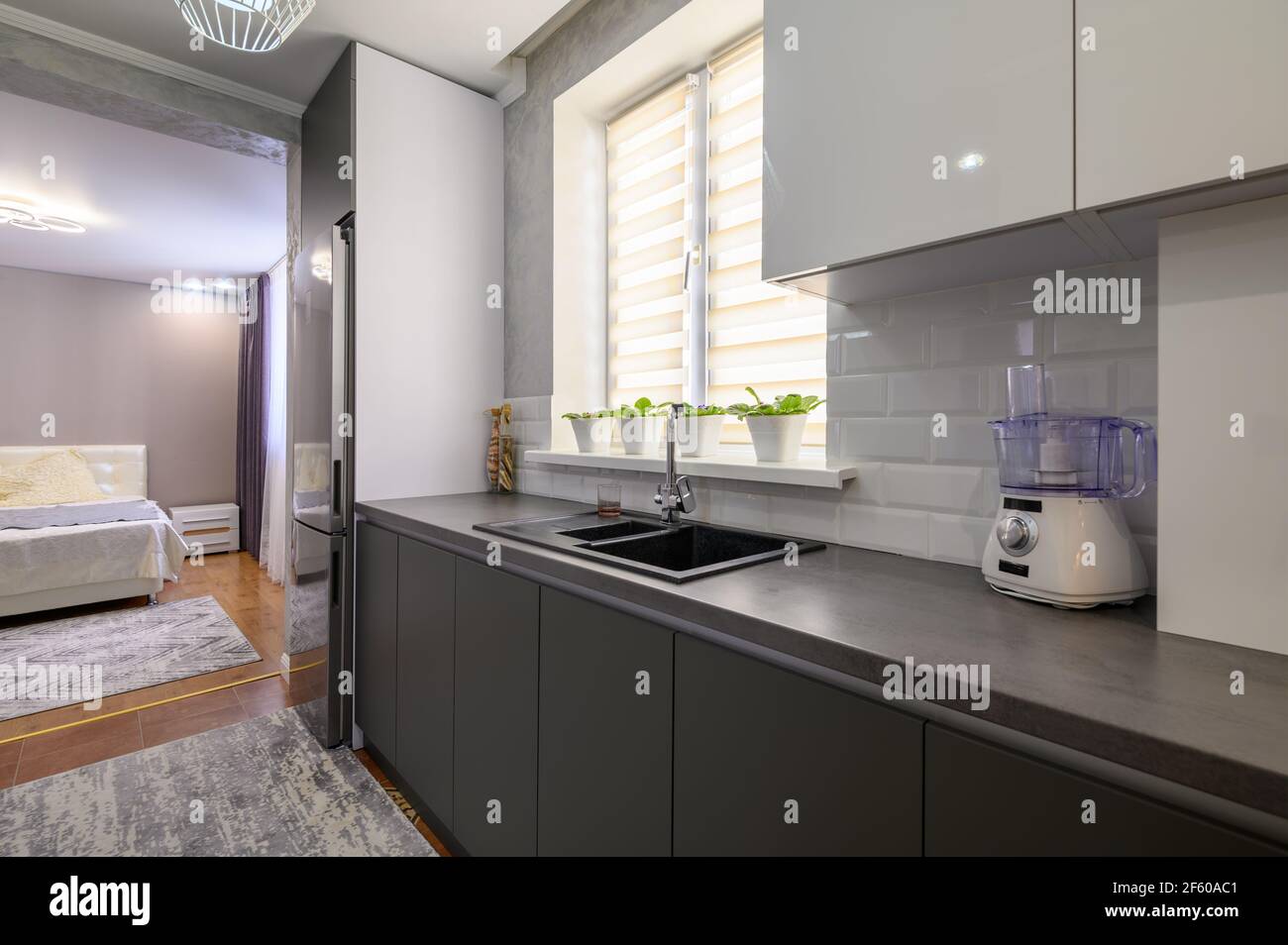 Modern dark grey small kitchen interior Stock Photo - Alamy
